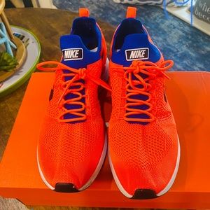 Mens Nike running shoes. NWOT. Size 11. Fluorescent orange and blue.